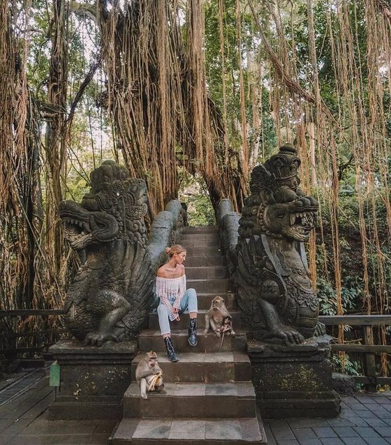 Posing with monkeys at monkey forest