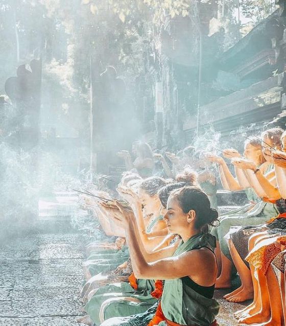 Praying at Tirta Empul Temple, Bali